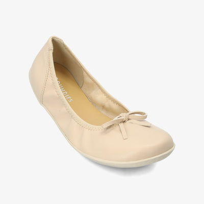 Light Beige Groundies Ruby leather ballet flat. Shoes are light beige all around with a leather bow and elastic around the openiing. Right shoe is shown here diagonally to the right against a white background. #color_light-beige