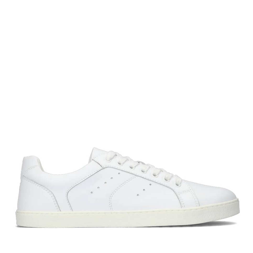 A photo of white Groundies Universe sneakers made of leather with classic sneaker details. Shown from the right side against a white background in this photo. #color_white