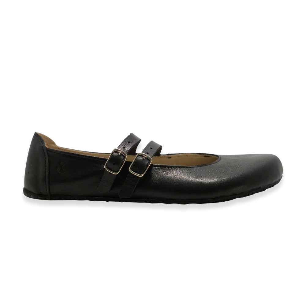 Black leather Villet Mary Jane flats with double straps with silver buckle closures, tan leather lining, and black rubber soles. Right shoe is shown facing right against a white background. #color_black-smooth