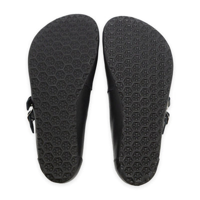 Black leather Villet Mary Jane flats with double straps with silver buckle closures, tan leather lining, and black rubber soles. Both shoe soles are shown from above against a white background. #color_black-smooth
