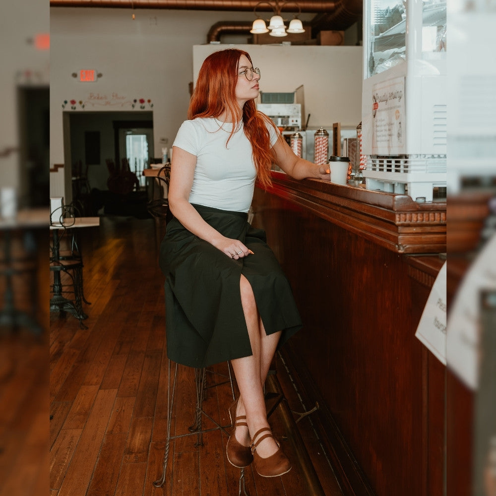 Brown leather Villet Mary Jane flats with double straps with silver buckle closures, tan leather lining, and beige rubber soles. #color_brown-nubuck