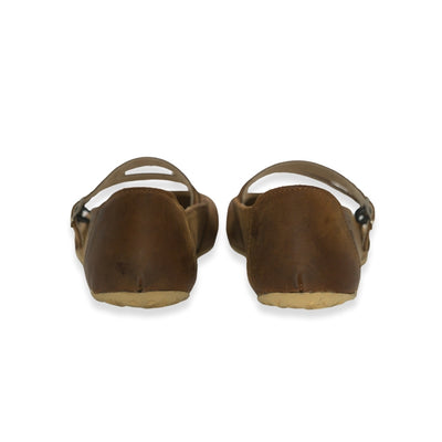 Brown nubuck leather Villet Mary Jane flats with double straps with silver buckle closures, tan leather lining, and tan rubber soles. Both shoes are shown from behind against a white background. #color_brown-nubuck