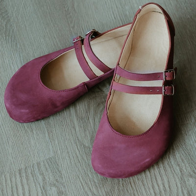 Mauve leather Villet Mary Jane flats with double straps with silver buckle closures, tan leather lining, and black rubber soles. #color_mauve-nubuck