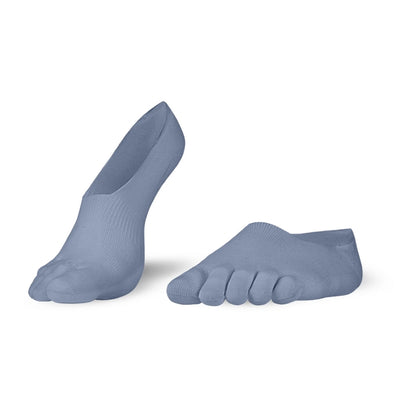 A photo of Knitido low cut toe socks made with cotton, nylon, polyester, and elastane. The socks are a blue/grey color. Both socks are shown beside each other angled slightly to the left, the right sock has its heel lifted off the ground against a white background. #color_blue-grey