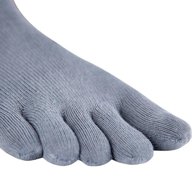 A pair of blue grey Knitido ankle-height sneaker toe socks. Right sock is shown close up on the toes facing diagonally right against a white background. #color_blue-grey