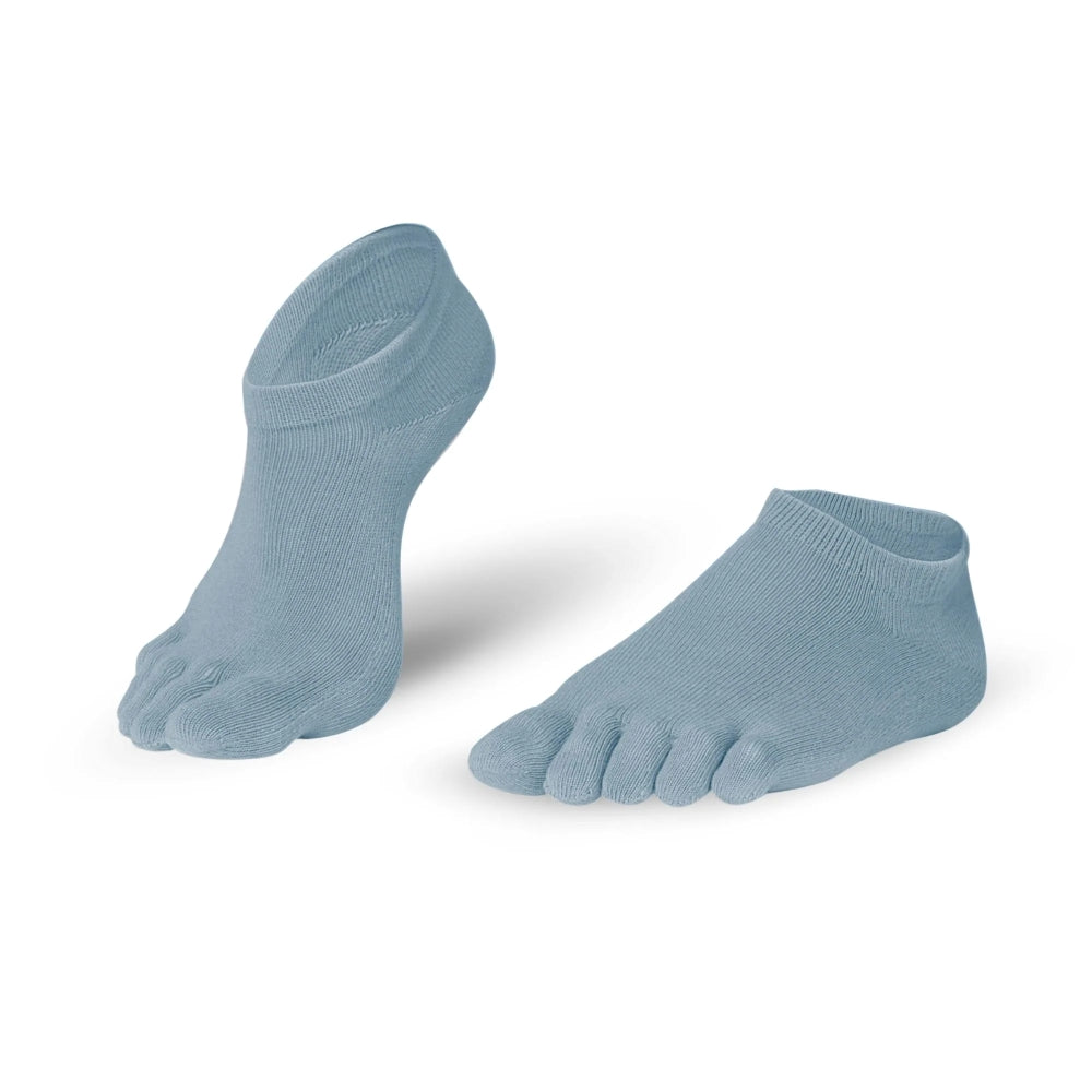 A pair of blue grey Knitido ankle-height sneaker toe socks. Both socks are shown facing diagonally left against a white background with the right heel up. #color_blue-grey