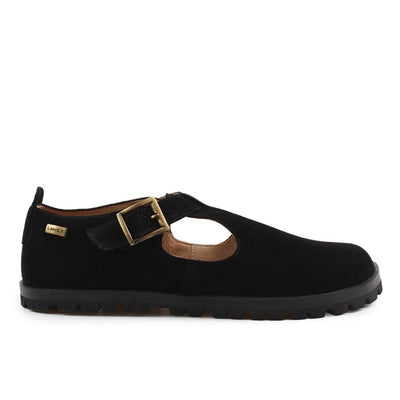 A black, suede t-bar flat with tan lining, a gold buckle, thick black soles, and a small pull tab in the back. Right shoe is shown facing right against a white background. #color_black