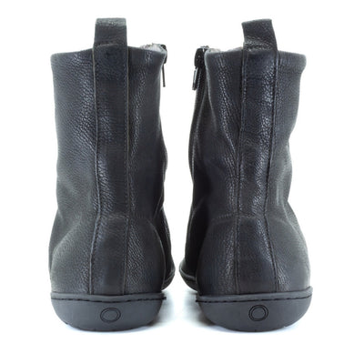 Black, leather, wool-lined Mukishoes Igneous combat-style, zip-up boots. Both shoes are shown from the back against a white background. #color_black