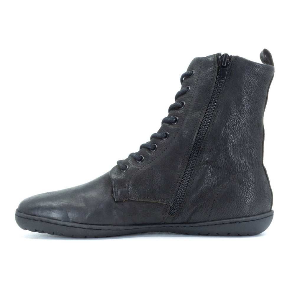 Black, leather, wool-lined Mukishoes Igneous combat-style, zip-up boots. Right shoe is shown facing left showing the zipper against a white background. #color_black