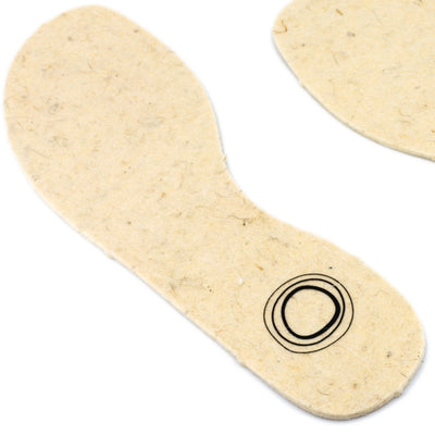 Two cream wool and hemp fiber insoles with the Mukishoes logo at the heel shown from facing diagonally left from above against a white background.
