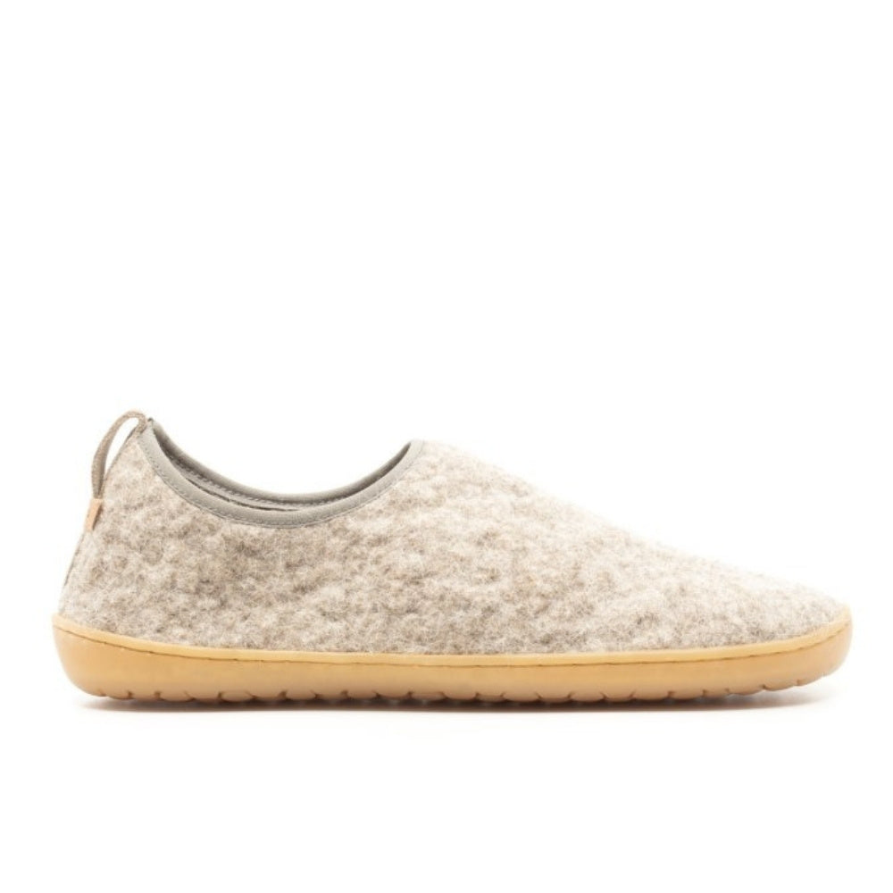 An ankle-height, natural, felted wool-colored Mukishoes Pantufa slipper with a back pull tab, small elastic edge around the opening, and a natural rubber sole. Right shoe is shown facing right against a white background. #color_grey