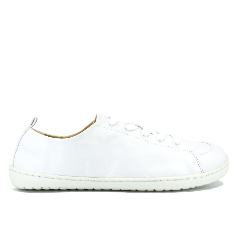 A photo of white Mukishoes Raw Leather Cloud sneakers. Shoes are simple in design, have a pull tab on the back, and tan leather lining. Right shoe is shown here facing to the right against a white background. #color_raw-leather-cloud