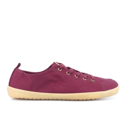 A photo of Mukishoes Roma fabric sneakers. Shoes are a deep wine color, simple in design, have a pull tab on the back, and a deep-wine colored lining, laces, and gum colored soles. Right shoe is shown here facing right against a white background. #color_roma