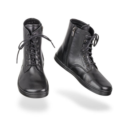 Black Peerko Breeze unlined leather combat boots. Both boots are shown floating against a white background. Left shoe is shown from the front and the right shoe is facing diagonally right. #color_black