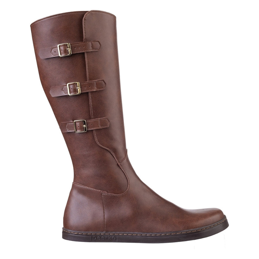 Peerko Joana brown leather knee-high boot in profile, featuring three adjustable brass buckle straps down the shaft and “peerko” embossed on the sole. #color_brown