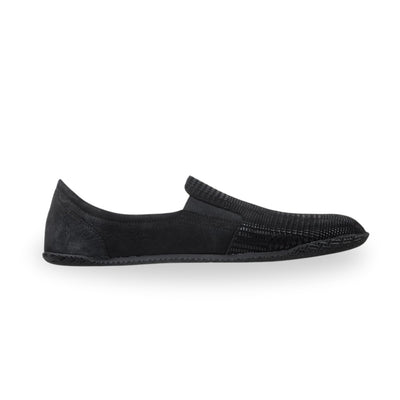 Black Peerko Trim leather loafer with a sheen mixed houndstooth and plaid pattern atop suede, black rubber soles, and two small elastic panels. Left shoe is shown facing right against a white background. #color_nyx