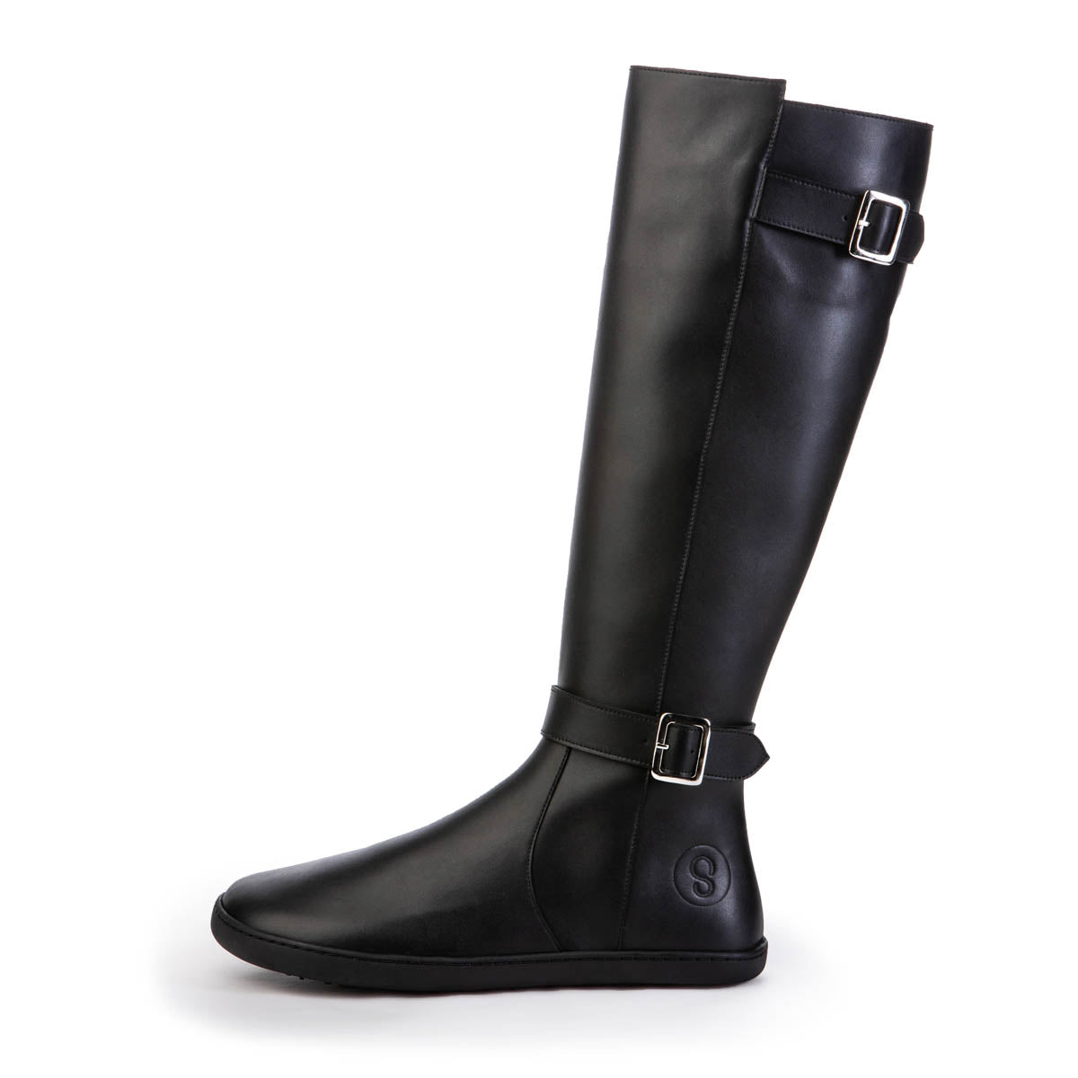 A photo of Shapen Glam lined riding boots made with leather, a faux fur lining, and rubber soles. The boots are black in color with silver buckles on the top and around the ankle, the ankle buckle strap is removable. One boot is shown from the left side against a white background. #color_black