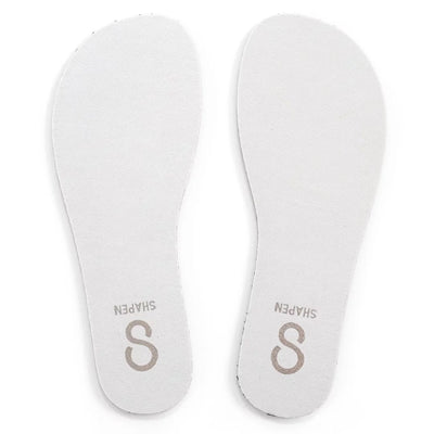 White leather Shapen insoles shown from above against a white background.