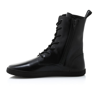 Black leather Shapen Maverick combat boots with a black, branded pull tab, a side zipper, black laces, and black rubber soles. Right shoe is shown facing left against a white background. #color_black