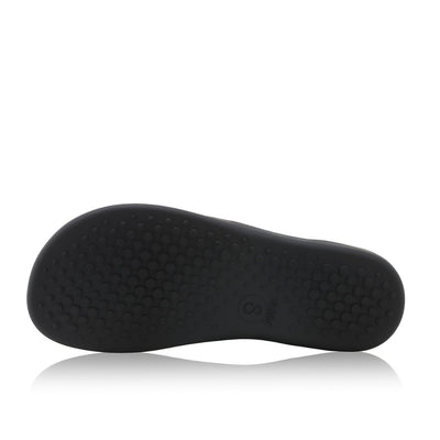 Black leather Shapen Maverick combat boots with a black, branded pull tab, a side zipper, black laces, and black rubber soles. Left shoe sole is shown facing left against a white background. #color_black