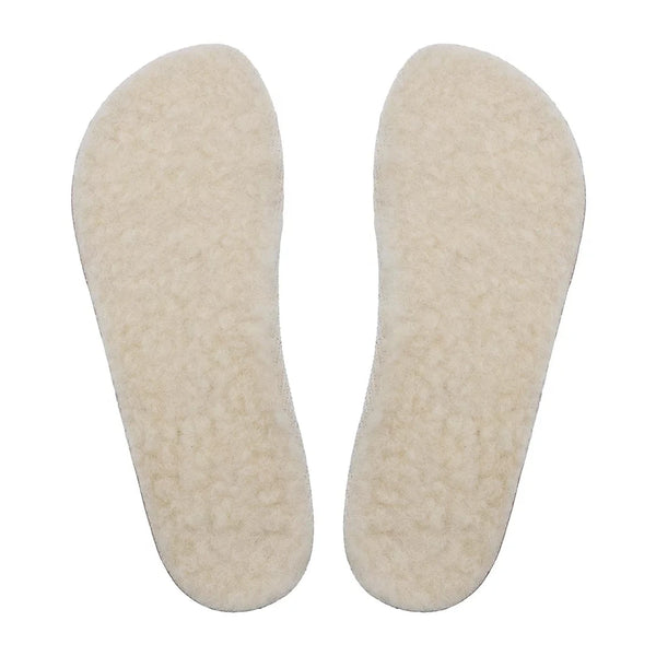 Two ivory Shapen merino wool sheepskin insoles shown from above against a white background.