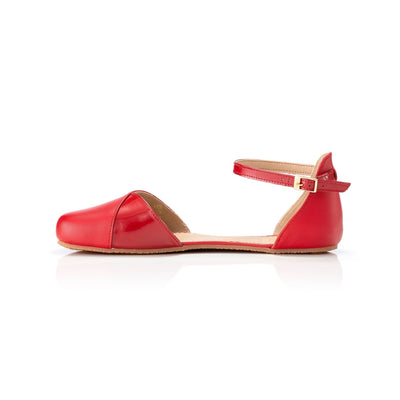 Red leather Shapen Poppy D’orsay dressy flats with a tan footbed and tan rubber soles. The flats have a heel cup held on by a dainty, patent leather ankle strap. Right flat is shown facing left against a white background. #color_cherry