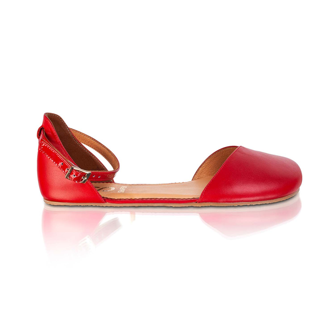 A photo of Shapen Poppy D’orsay dressy flats with a leather upper and rubber soles. The flats are a cherry red color with a heel cup and dainty ankle strap, the inside of the sole are a beige color. Right flat is shown from the right against a white background. #color_red