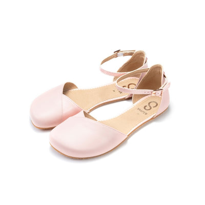 Rose leather Shapen Poppy D’orsay dressy flats with a tan footbed and tan rubber soles. The flats have a heel cup held on by a dainty, patent leather ankle strap. Both flats are shown facing diagonally left against a white background. #color_rose