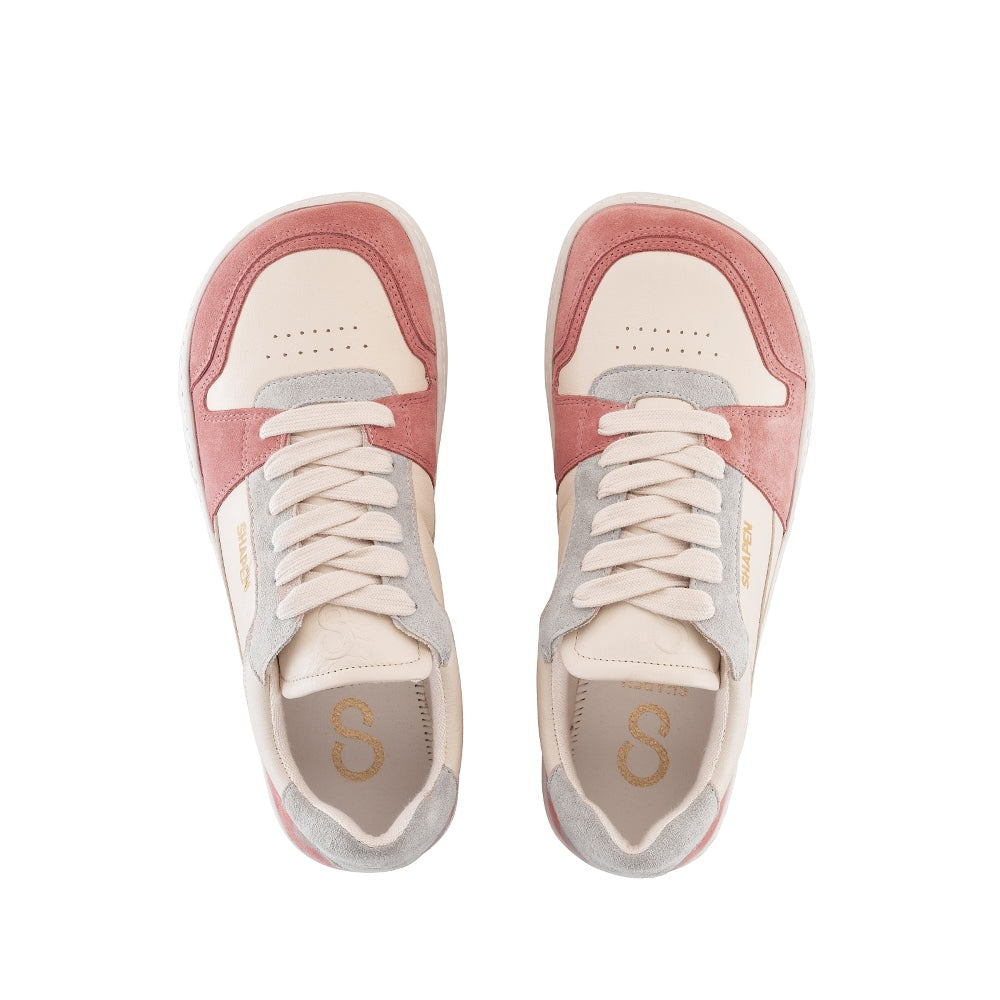 Peach Shapen ReWind leather sneakers. Shoes are a classic chunky sneaker design with light pink leather and peach suede color blocks surrounding the toe guard and heels. Light grey suede color blocks are on the perimeter of the laces and the top of the heel. Both shoes are shown from above against a white background. #color_peach