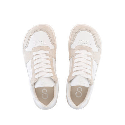 A photo of Shapen ReWind leather sneakers in white. Shoes are a classic chunky sneaker design with beige suede color blocks surrounding the toe guard, laces, and heels. Both shoes are shown here from the top down against a white background. #color_white