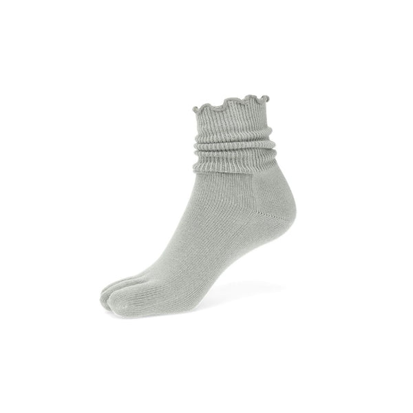 A muted green ruffle crew toe sock shown facing diagonally left against a white background. #color_light-green