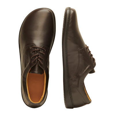 Dark Brown Zaqq Peaq leather dress shoes with dark brown laces and black rubber soles. Left shoe is shown from above next to the right shoe leaning over against a white background. #color_dark-brown