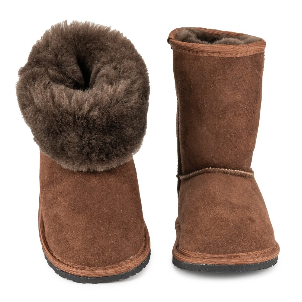 A photo of brown kids Zeezoo dingo boots made with sheepskin and rubber soles. Boots rise to about just under the calf. Both boots are shown from the front with the left boot rolled down against a white background. #color_brown