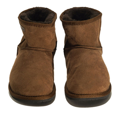 A plain brown Zeazoo Dingo Mini sheepskin ankle boot with a back pull tab, brown wool lining, and black rubber vibram soles. Both shoes are shown from the front against a white background. #color_brown