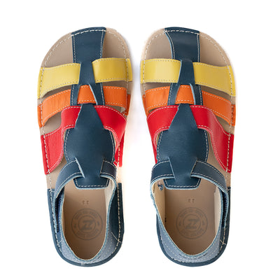 A photo of the Zeazoo Marlin lids leather play sandals. The sandals are navy blue in color and have yellow, orange, and red straps weaved across the top of the shoe, and a velcro closure around the ankle. Both shoes are shown together from above on a white background. #color_navy-yellow-orange-red
