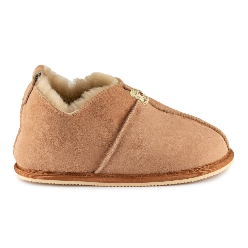 Zeezoo Shaun hand made suede, sheepskin, and tan rubber slippers. The slippers are composed of 4 panels sewn together with seams on the sides, back, and top. Right slipper is shown facing right against a white background. #color_chestnut