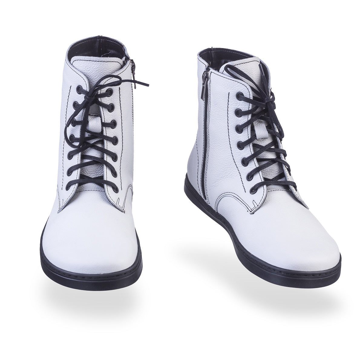 A photo of Peerko Go combat boots made with smooth leather, fleece, and rubber soles. The boots are white in color, fleece lined, with a zipper at the side. Both boots are shown floating forward angled slightly to the right against a white background. #color_white