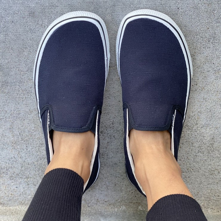 Black slip on vans fashion on feet