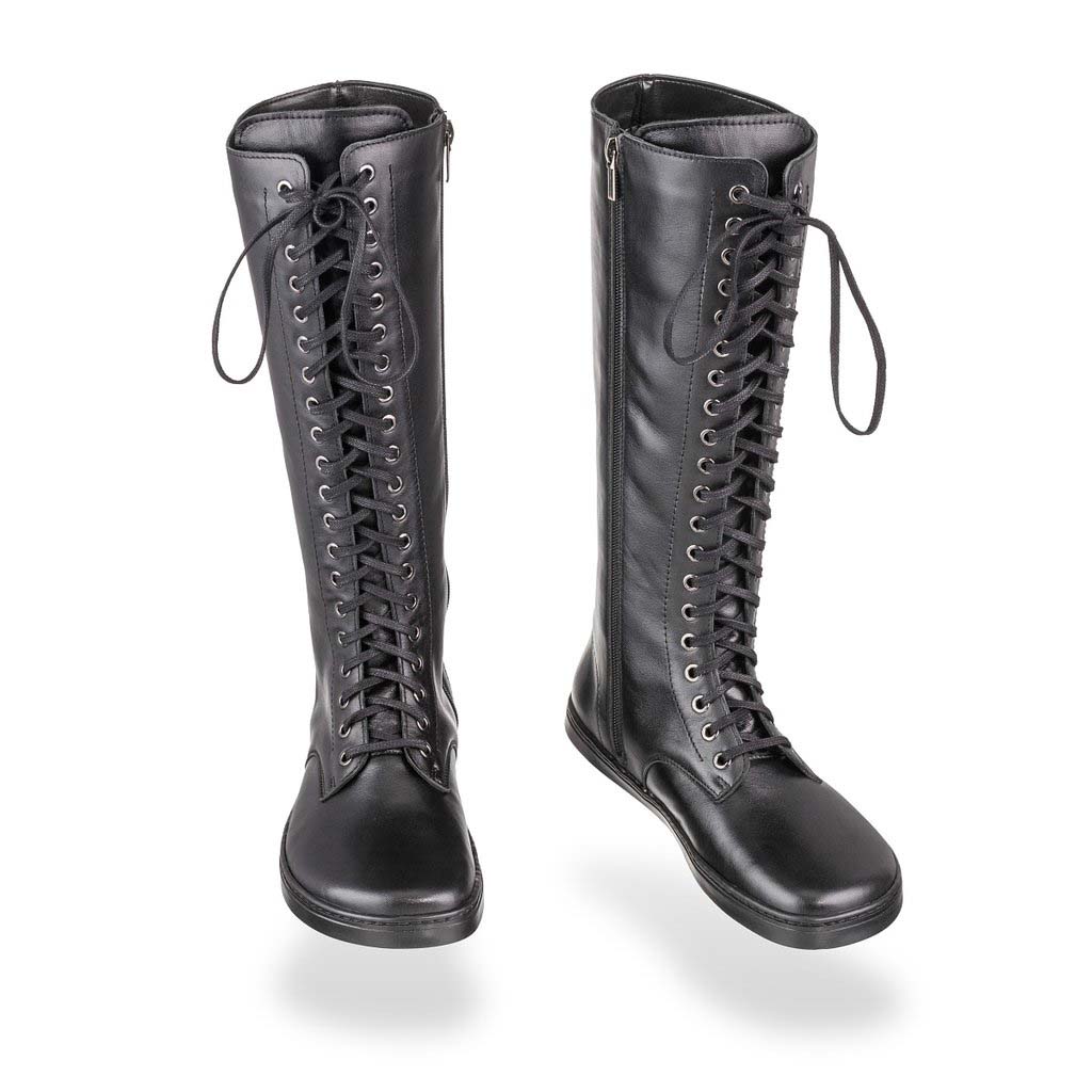 A photo of Peerko Empire boots made from leather and rubber soles. The boots are black in color, they are a tall riding boot style with laces all the way up and a side zipper. Both boots are shown beside each other from the front, the left boot is slightly angled to the right against a white background. #color_black