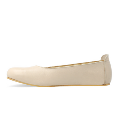 A beige barefoot ballet flat shown  from the left side of the right shoe on a white background #color_beige