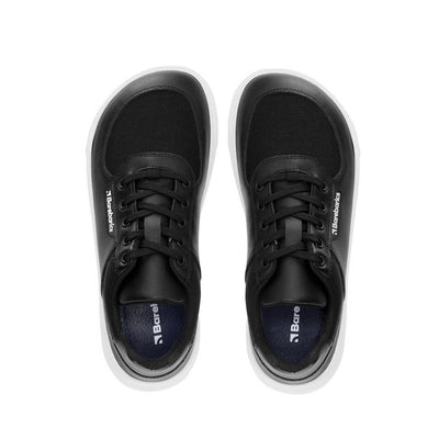 Photo 1 - A photo of Barebarics Bravo sneakers. The sneakers are made with white rubber soles and black textile fabric topped with black leather borders around the toe box, laces, and heel. Right sneaker is shown here from the right side against a white background., Photo 2 - Both shoes are shown from the top down against a white background. #color_black-white