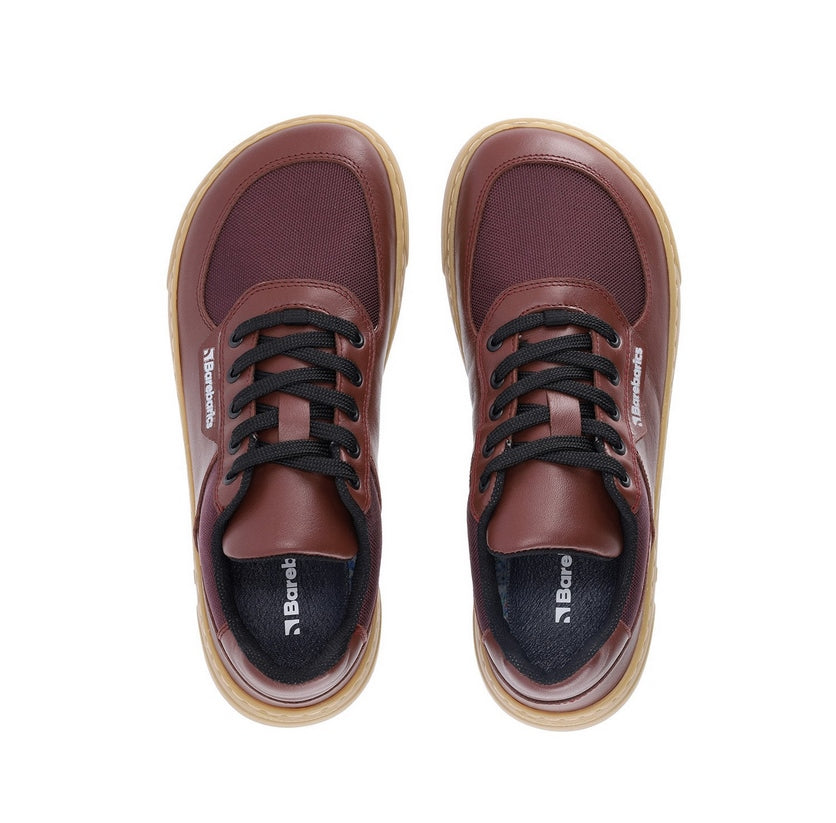 Photo 1 - A photo of Barebarics Bravo sneakers. The sneakers are made with gum rubber soles and maroon brown textile fabric topped with lighter maroon brown leather borders around the toe box, laces, and heel. Laces are black. Right sneaker is shown here from the right side against a white background., Photo 2 - Both shoes are shown from the top down against a white background. #color_maroon-brown