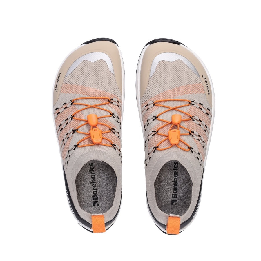 Photo 1 - A photo of Barebarics Voyager active sneakers. The sneakers are made with a beige sock-like stretch fabric with black protector fabric around the front and back of the shoe. Interwoven black strings on either side hold the orange elastic quick laces in place. Right sneaker is shown here from the right side against a white background., Photo 2 - Both shoes are shown from the top down against a white background. #color_beight-white