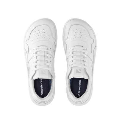 A photo of Barebarics Zing sneakers made with a leather upper and a rubber sole. The sneakers are a white color with perforated spots on the top of the toe box and barebarics branding on the tongue and side. Both sneakers are shown facing upright beside each other from the top down against a white background. #color_white