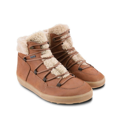 A photo of Belenka Bliss Boots made from nubuck leather and tan rubber soles. The boots are brown in color, have a fleece tongue and around the top. The laces are wide across the boot top and have speed hooks at the by the top. Both shoes are shown beside each other from the front angled slightly to the right against a white background. #color_brown