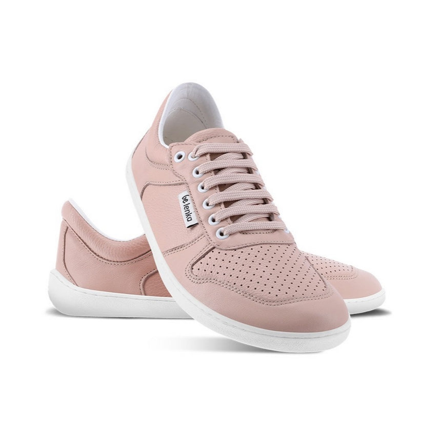 A photo of Nude Pink Be Lenka Champ 3.0 Retro Sneaker with white soles. Left shoe is shown from the right with the right shoe propped up on the left to show the top of the shoe. Background is white. #color_nude-pink