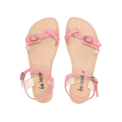 Photo 1 - Be Lenka Claire leather sandals in flamingo pink. Sandals have an open heel ankle strap that fascines with a gold buckle, and connects to both sides of the sole. A criss-cross toe strap is featured at the big toe with a gold buckle connecting a thin toe strap to a thicker strap on the outside. Shoes are shown diagonally from the right side with a white background., Photo 2 - Both shoes are shown from the top down against a white background. #color_flamingo-pink