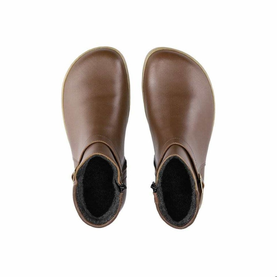 A photo of Be Lenka Diva boots in dark brown with tan soles. Boots are made from dark brown leather. A quilted leather design is present in the back, a silver buckle on the side, a strap around the ankle, and a zipper. Both boots are shown from the top down against a white background. #color_dark-brown