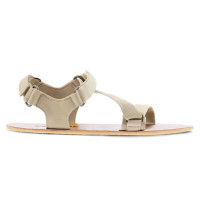 A photo of Beige Green Be Lenka Flexi Sandals made with fabric straps with velcro and a tan leather topped rubber soles. The sandals are a light beige green color and have straps that cross the front of the foot and continue around the mid-foot, ankle, and heel. One sandal is shown from the right side against a white background in this photo. #color_beige-green