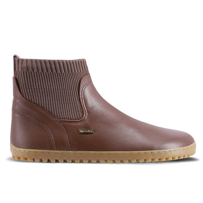 A photo of Be Lenka Mojo boots in dark brown with tan soles. Boots are made from smooth black leather and a knit opening hugging around the ankle. Right shoe is shown from the right side against a white background. #color_dark-brown